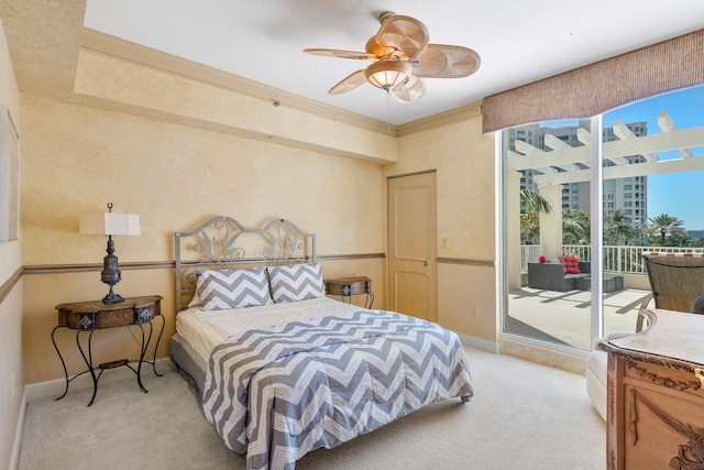 bedroom with light colored carpet, ceiling fan, and access to outside