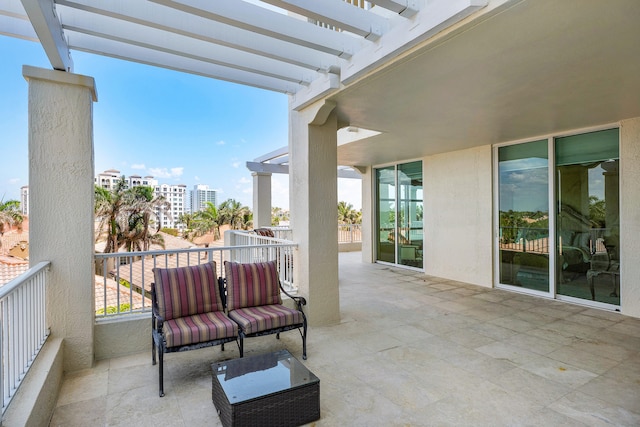 exterior space with a balcony and a pergola