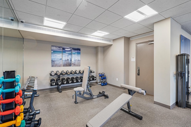 exercise area featuring a drop ceiling