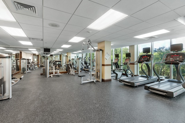 workout area with a paneled ceiling