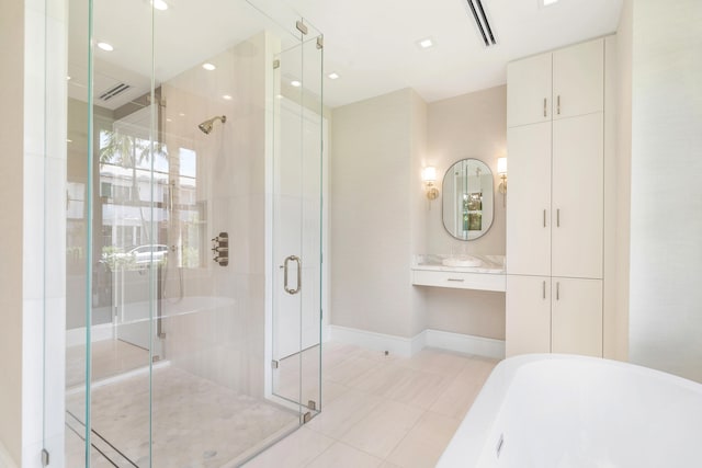 bathroom featuring vanity, tile patterned floors, and shower with separate bathtub