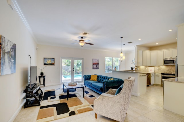 living room with ceiling fan, french doors, ornamental molding, and light tile patterned floors