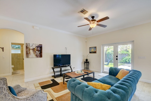 living room with ornamental molding, ceiling fan, french doors, and light tile patterned flooring