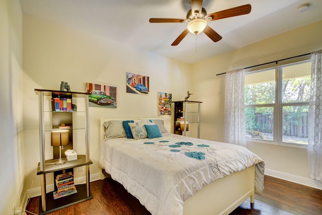 bedroom with ceiling fan and dark hardwood / wood-style flooring