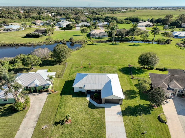 drone / aerial view with a water view