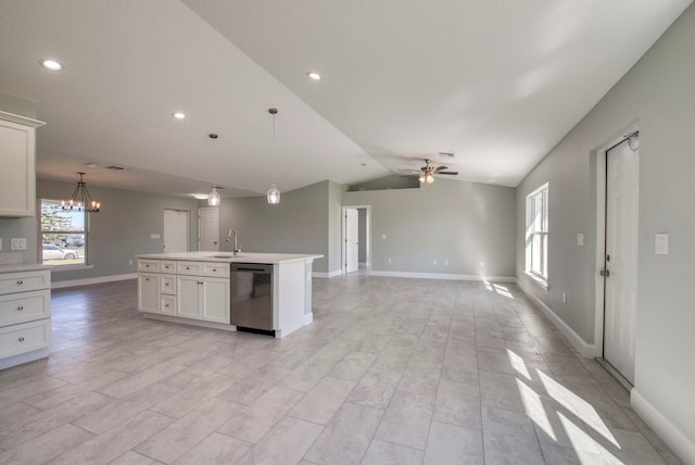 kitchen featuring white cabinets, vaulted ceiling, sink, a center island with sink, and dishwasher