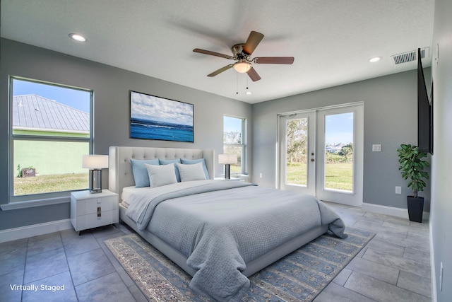 bedroom with ceiling fan and french doors