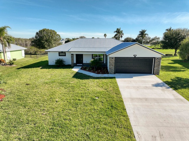 single story home with a garage and a front lawn