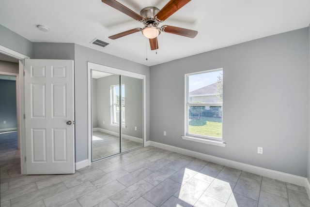 unfurnished bedroom featuring a closet and ceiling fan