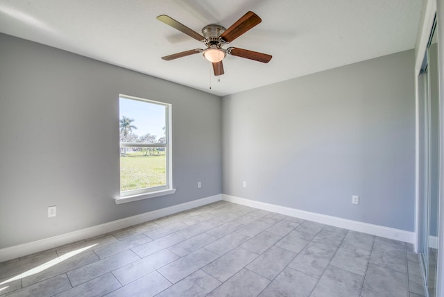 unfurnished room with ceiling fan