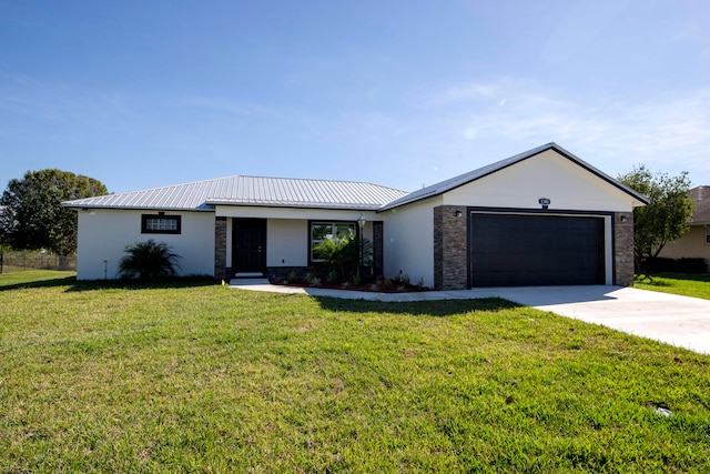 ranch-style home featuring a front lawn and a garage