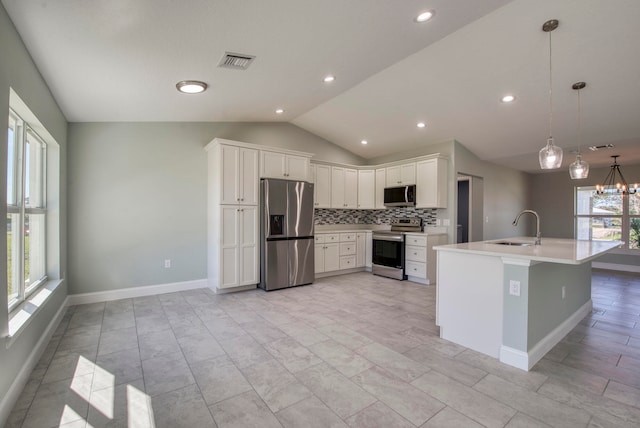 kitchen featuring white cabinets, a healthy amount of sunlight, sink, and stainless steel appliances