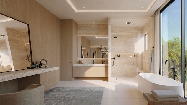 bathroom with tile patterned floors, vanity, separate shower and tub, and a tray ceiling