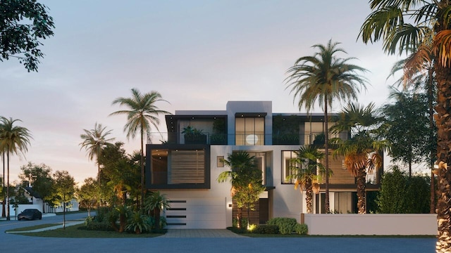 contemporary home with a balcony and a garage