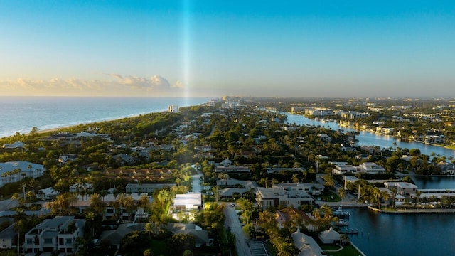 aerial view at dusk with a water view