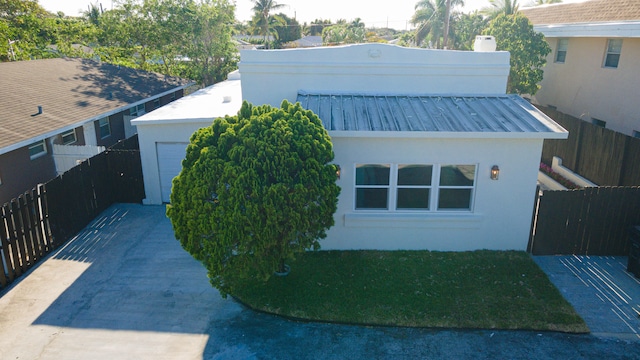 view of side of property featuring a garage