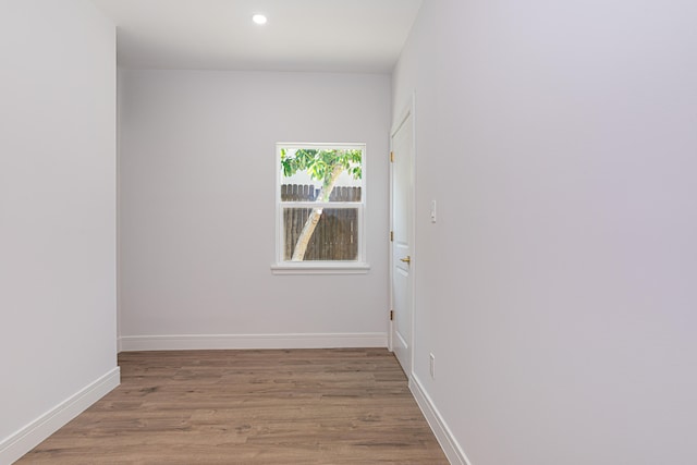 unfurnished room with light wood-type flooring