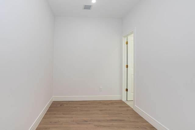 unfurnished room with light wood-type flooring