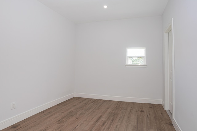 spare room with dark hardwood / wood-style floors