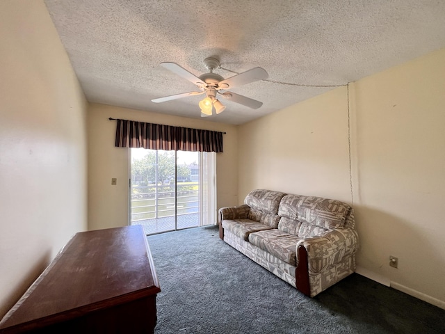 carpeted living room with ceiling fan and a textured ceiling