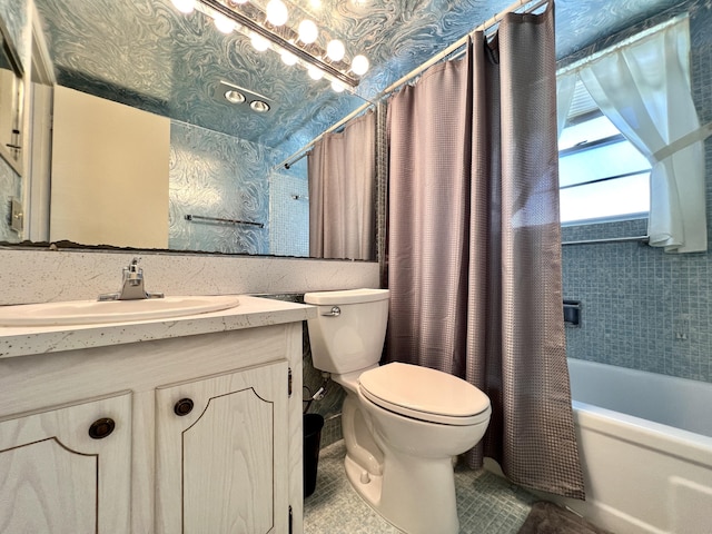 full bathroom with shower / tub combo with curtain, vanity, and toilet