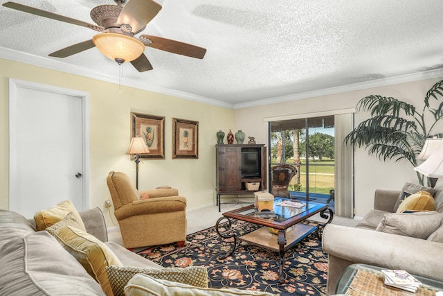 living room with ornamental molding, carpet flooring, ceiling fan, and a textured ceiling