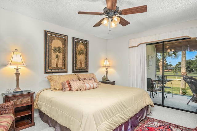 bedroom with a textured ceiling, carpet floors, ceiling fan, and access to outside