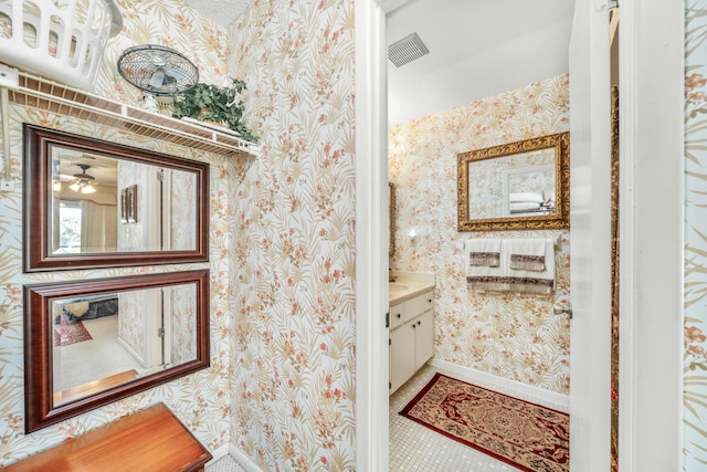 bathroom with ceiling fan, vanity, and tile flooring