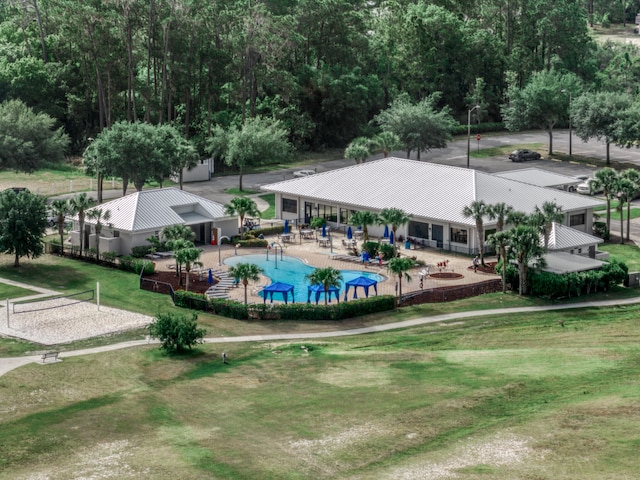 view of nearby features with a patio, a swimming pool, and a yard