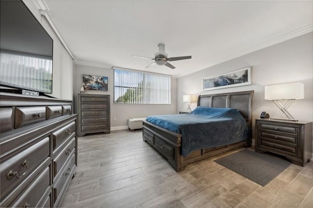 bedroom with ornamental molding, light hardwood / wood-style flooring, and ceiling fan