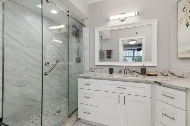 bathroom featuring oversized vanity, tile floors, and a shower with shower door