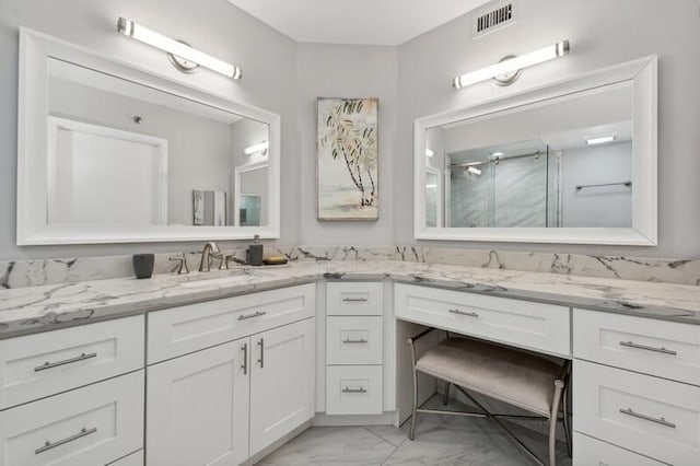 bathroom with tile floors and dual vanity