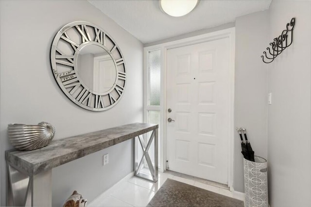 foyer entrance with tile floors