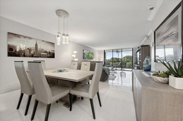 dining space featuring ornamental molding, floor to ceiling windows, and light tile flooring