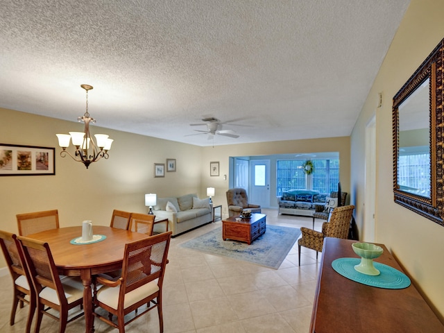 tiled living room with ceiling fan and a textured ceiling