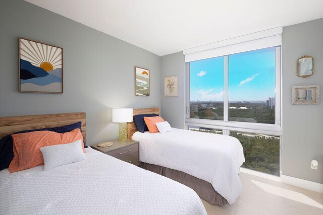 bedroom featuring light tile floors