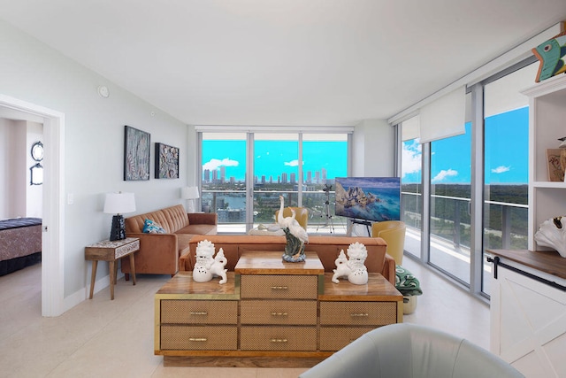 living room with a wall of windows and light tile flooring