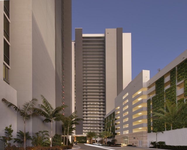 view of outdoor building at dusk