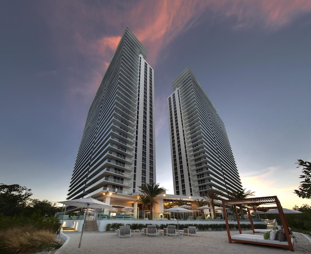 view of outdoor building at dusk