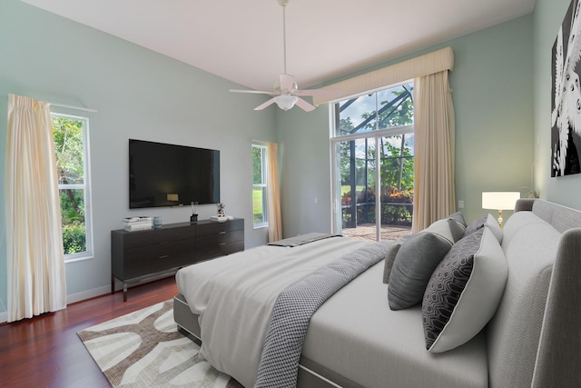 bedroom featuring ceiling fan, dark hardwood / wood-style floors, and access to outside