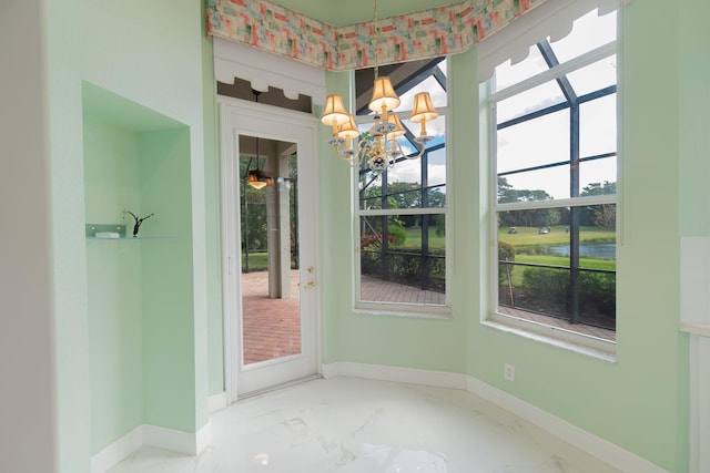 unfurnished dining area featuring an inviting chandelier