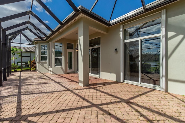 view of patio with a lanai