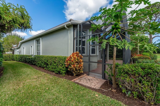 view of property exterior featuring a yard