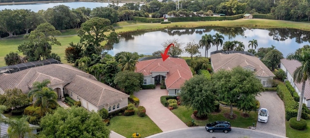 birds eye view of property with a water view