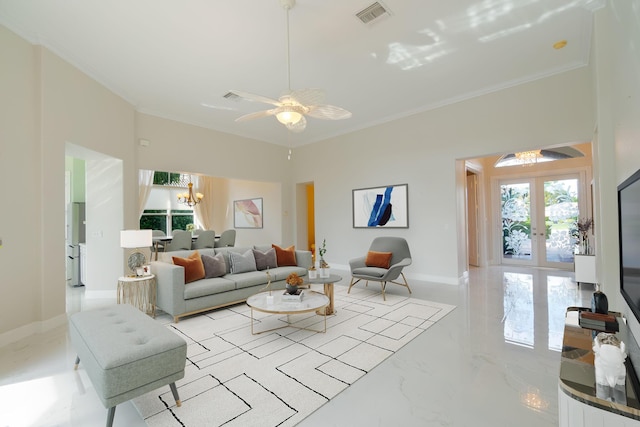 living room featuring crown molding, ceiling fan with notable chandelier, and french doors