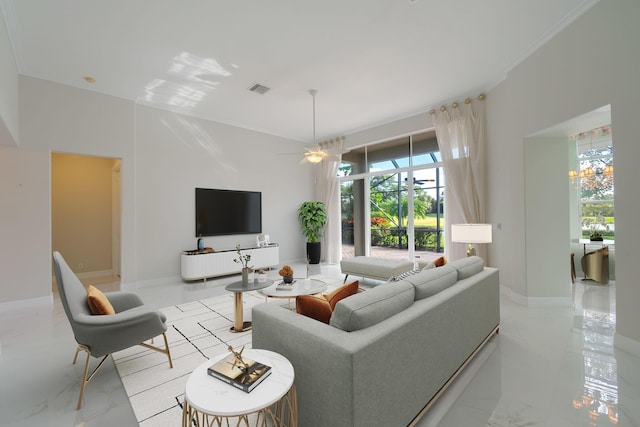 living room with ceiling fan and ornamental molding