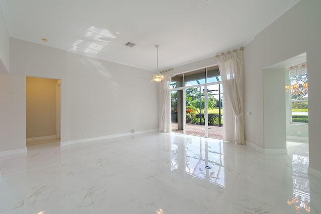 empty room with crown molding and ceiling fan