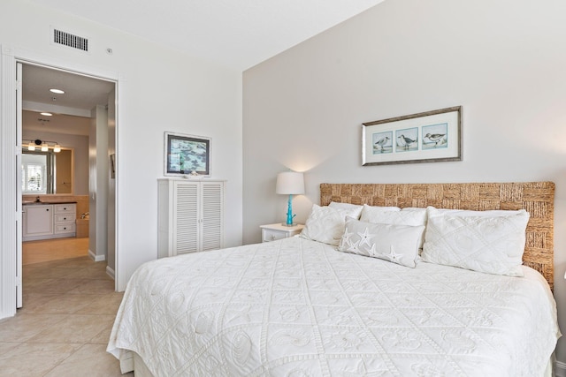 tiled bedroom with ensuite bathroom