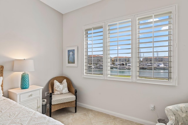 tiled bedroom with a water view