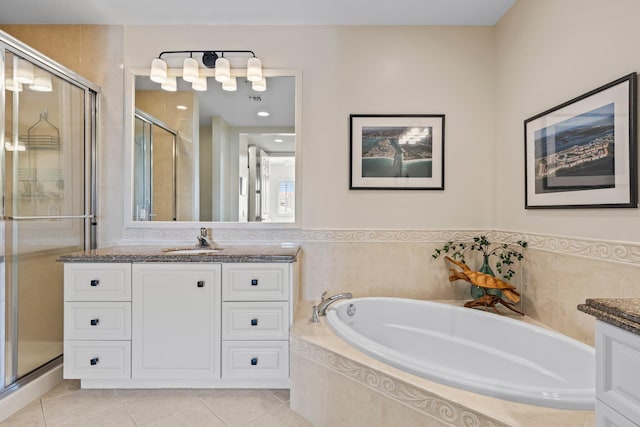 bathroom with vanity, plus walk in shower, and tile patterned flooring